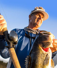 Shimano CURADO DC 150HG reel side view highlights compact profile for comfortable grip.