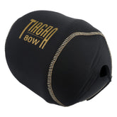 Shimano Tiagra reel cover front view with gold logo on glossy black fabric.