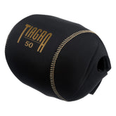Shimano Tiagra reel cover with gold logo on glossy fabric for premium protection.