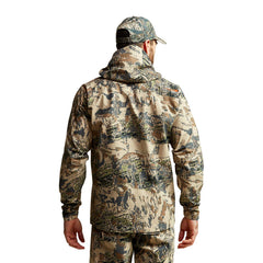 SITKA Dew Point hood deployed in changing weather for instant coverage.