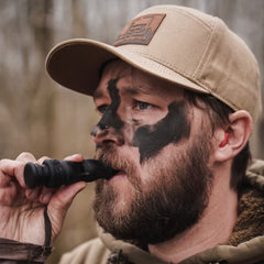 Slayer Calls Call The Wild Whistler’s Mother 4-in-1 duck whistle in hand for quick, reliable calling.