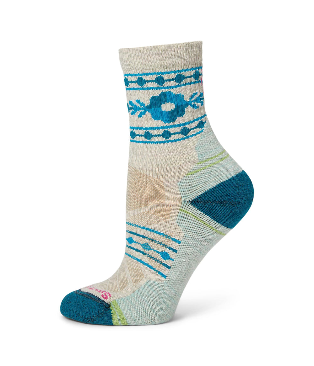 Smartwool women's Hike Light Cushion Retro Floral Mid-Crew in Moonbeam offer durable comfort on trails