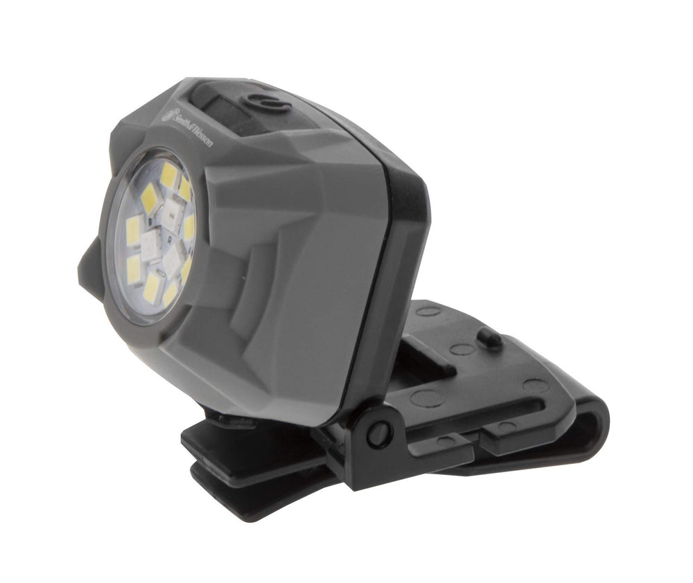 Smith & Wesson Night Guard headlamp worn on the head for hands-free lighting during tasks.