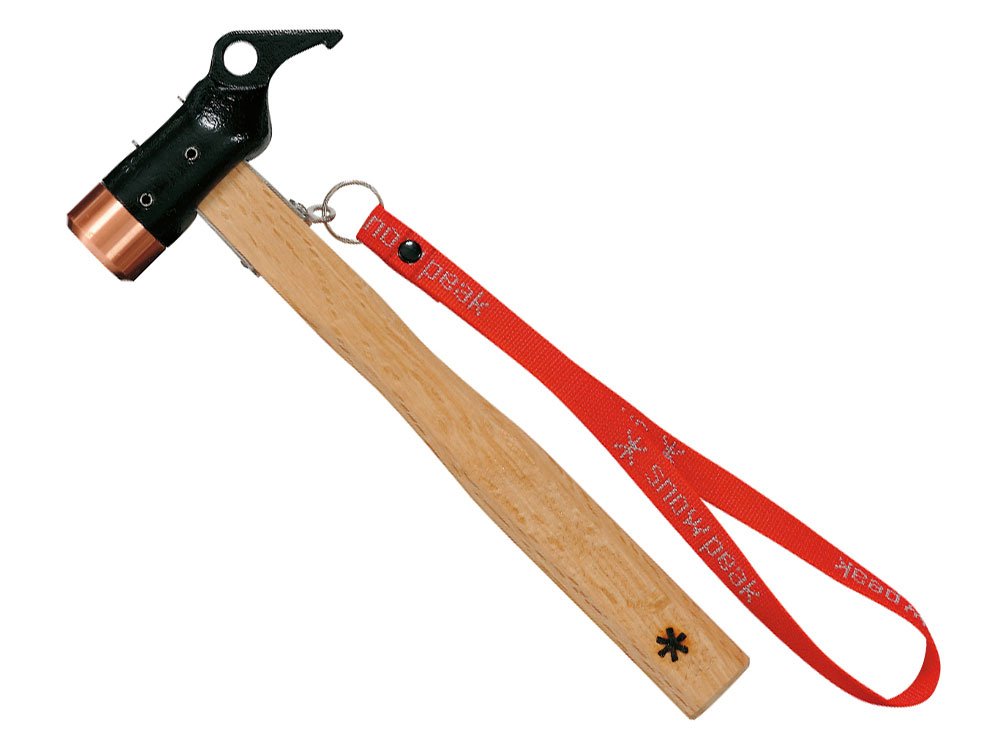 Snow Peak Copper Peg Hammer for Tent Stakes driving stakes securely on varied terrain.