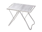 Snow Peak Takibi My Table packable design provides a portable, stable surface beside a fire pit.