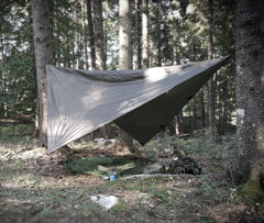 Snugpak All Weather Shelter G2 diamond tarp in action, keeping gear dry.