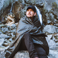 Snugpak Jungle Blanket laid flat shows full 76 by 64 inch coverage.