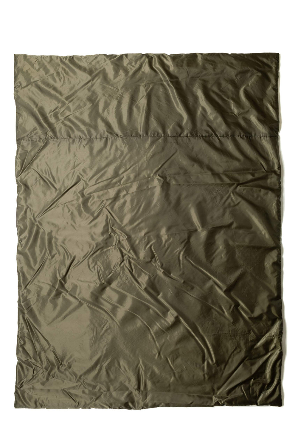 Snugpak Jungle Blanket XL folded for compact storage, ready for quick warmth on outdoor trips.