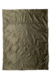 Snugpak Jungle Blanket XL folded for compact storage, ready for quick warmth on outdoor trips.