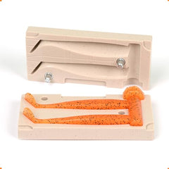 Two cavity injection mold for soft plastics with open cavities