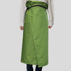 SOUUXIU Rain Skirt worn over hiking attire during a gear-heavy ascent.