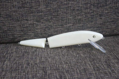 Speedlures 5-piece unpainted jointed musky lure blanks arranged for painting