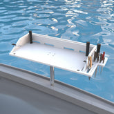 Spirrelab bait cutting board on boat offers 31x13 surface with integrated rod holder for fish prep