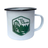 SQUATCH METALWORKS Leave Only Footprints mug front view, rugged enamel for outdoor adventures.