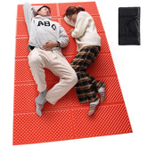StableEase orange 2-person pad folded accordion saves space for camping gear.