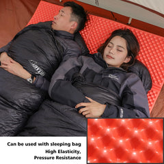 StableEase orange 2-person sleeping pad unfolded reveals a spacious sleeping area for two campers.