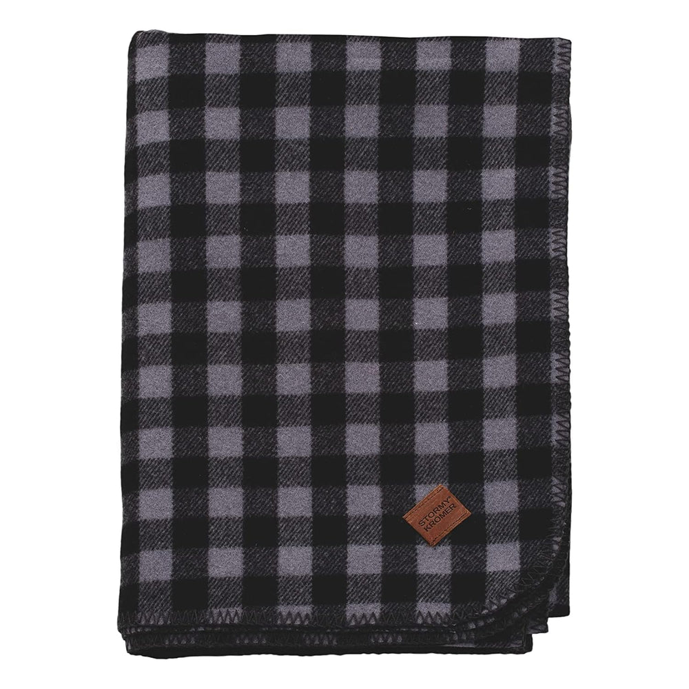 Stormy Kromer plaid wool blanket in black and gray, cozy warmth.