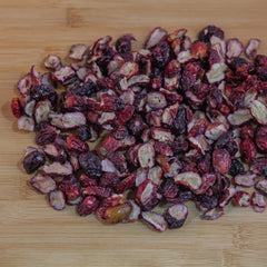 Survival Grocery Freeze-Dried Grape Halves held by hand for on-the-go snacking