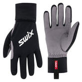 Swix Cover Glove foldable mitten cover providing instant weather protection for outdoor winter activities.