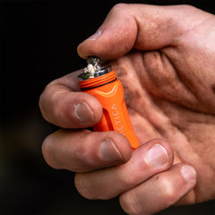 TACTICA X.100 waterproof storage shows dry tinder and puck stored securely