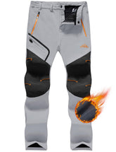 TACVASEN hiking pants with waterproof windproof shell protect against snow on winter trails.