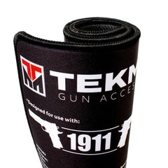 Close-up of Tekmat surface protecting firearm during maintenance