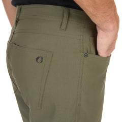 The American Outdoorsman men's 5-pocket stretch nylon pants durability shot demonstrates tear resistance on hikes