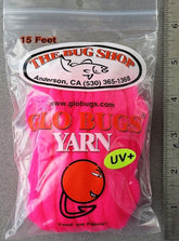 The Bug Shop Glo Bug Yarn ball showcases vibrant colorways for soft, durable knitting projects.