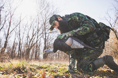 The Grind Bugging Hen decoy assembly-stakes shows quick setup in tough dirt, saving time.