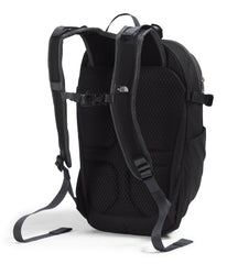 The North Face Basin 15L external-zip-pocket demonstrates fast-access storage during hikes.