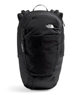 The North Face Basin 18L rain cover deployed for wet-weather hiking.
