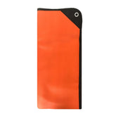 The Pathfinder School survival blanket orange folded in backpack for compact emergency shelter readiness.