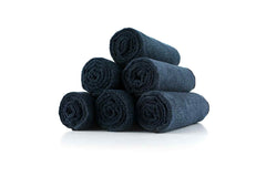 The Rag Company towel midnight used to wipe sweat during workouts and classes.
