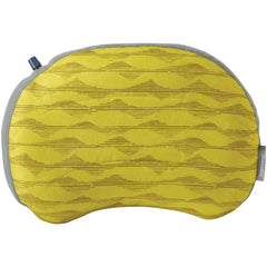 Therm-a-Rest Air Head Large Pillow in Yellow Mountains, inflated for stable camping comfort.