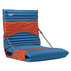 Therm-a-Rest Trekker Chair Kit in-use shows comfortable camp seating beside a fire.