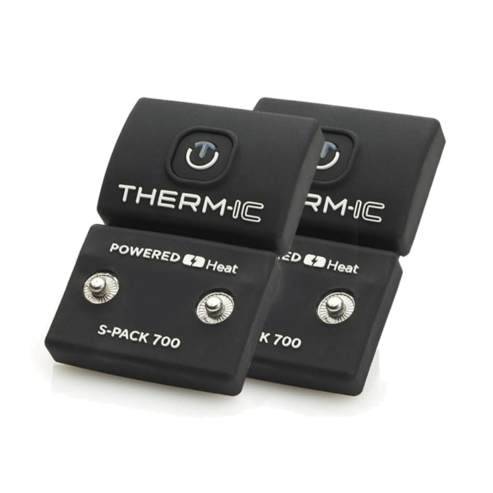 THERM-IC S-Pack 700 sock batteries held in hand, delivering portable warmth for winter outdoor activities.