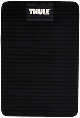 Thule 854 Water Slide Mat protects vehicle finish beneath rear saddles during loading.
