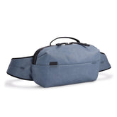Thule Aion sling bag with metal closure for fast access.