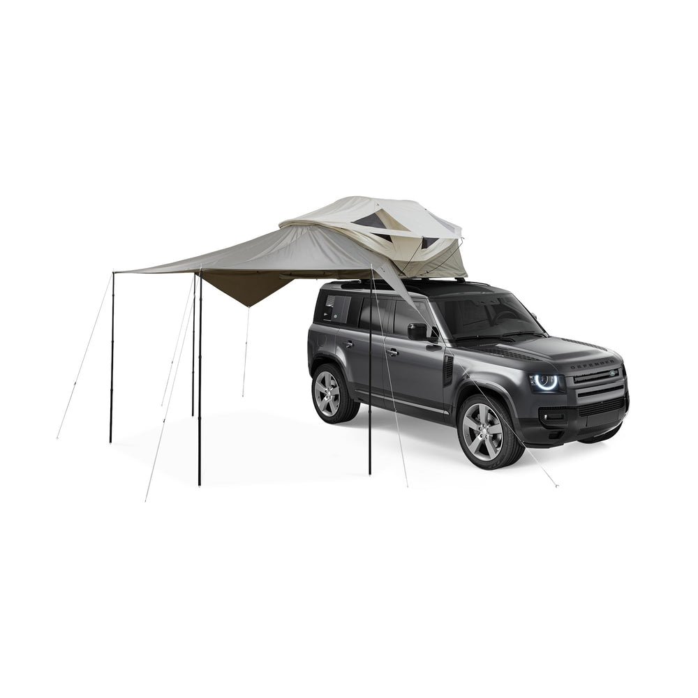 Thule Approach Awning S/M gray setup showing easy install for shade at the tent