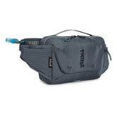 Thule Rail Pack 4L demonstrates a hose system for quick hydration on the trail