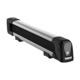 Thule SnowPack on a roof carrying four skis with scratch-free grips.