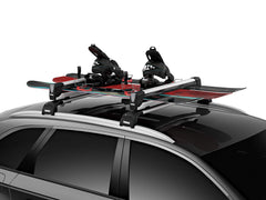 Thule SnowPack Extender loading with gloves demonstrates user-friendly access