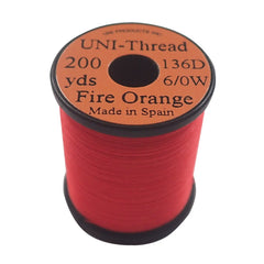 TIEMCO UNI thread in Fire Orange for secure wraps on standard-size flies.