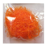 TIEMCO Hareline Polar Chenille Hot Orange pack close-up shows translucent fibers for versatile tying.