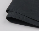 TIEMCO Hareline round rubber black medium closeup shows fluttering legs for lifelike water movement.