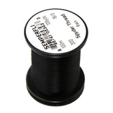 TIEMCO Spyder Thread 18/0 closeup shows translucent micro thread for delicate fly tying.