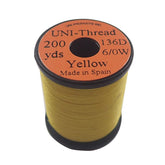 TIEMCO UNI Thread 6/0 Yellow spool for durable fly tying material.