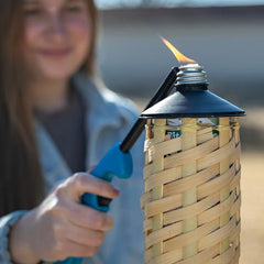 TIKI torch with 3/4 inch wick visible for proper ignition