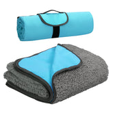 Tirrinia foldable waterproof outdoor blanket rolled for travel and storage.