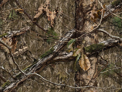 Titan 3D Mossy Oak 3D leaves swaying in wind for realistic concealment.